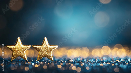 Two golden stars on a sparkling surface with blue bokeh background.