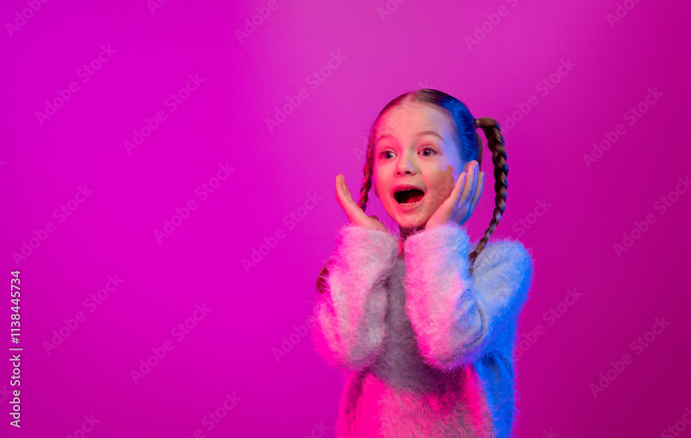 Fototapeta premium A preteen girl with braided hair shows excitement with a joyful expression, surrounded by neon lights in shades of pink and purple, copy space