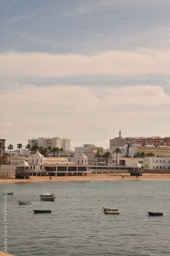 Fototapeta premium View of the beach and boats near the shore from the sea