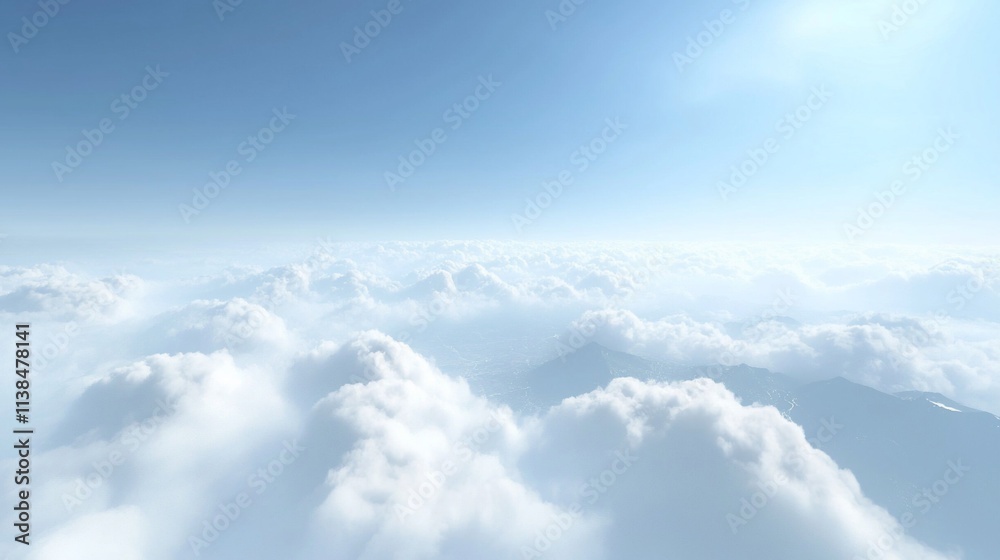 Fototapeta premium Aerial view of fluffy white clouds and mountains under a bright blue sky.