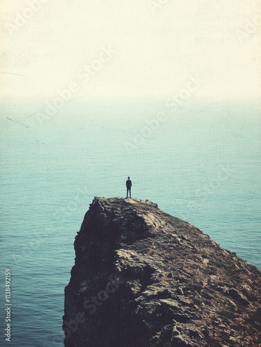 Solitary Figure on Coastal Cliff