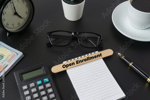 Business concept with a word Open Enrollment on black background