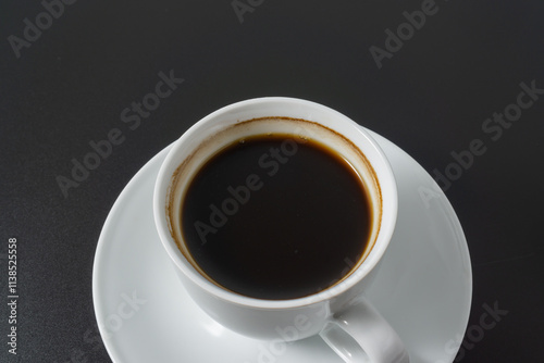 A cup of americano coffee on black background