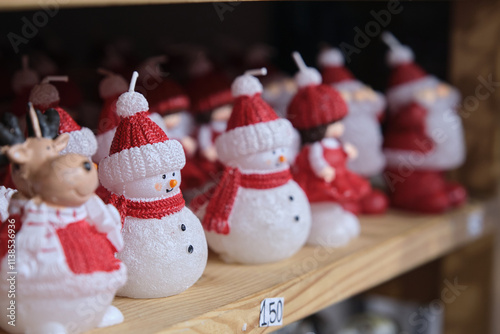 Snowman figures in the form of a candle photo