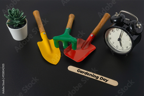 Gardening concept with a text Gardening Day on black background