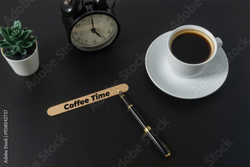 A cup of coffee with a text Coffee Time on black background