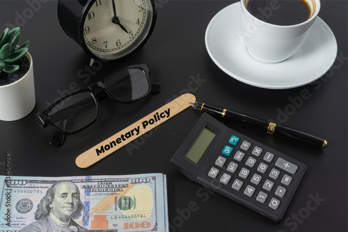 Business concept with a text Monetary Policy on black background