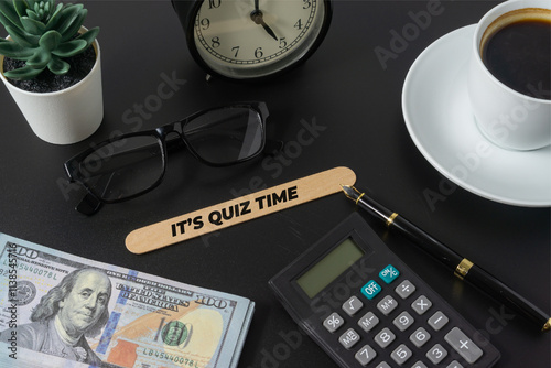 Business concept with a text Its Quiz Time on black background