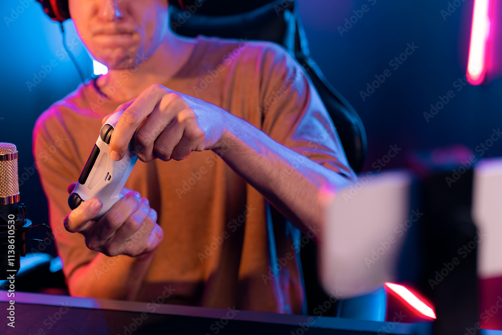 Enjoy smart gaming streamer with control joystick, playing game online of live streaming by smartphone rec with team skilled players on computer at modern technology cyber neon light room. Pecuniary. Enjoy smart gaming streamer with control joystick, playing game online of live streaming by smartphone rec with team skilled players on computer at modern technology cyber neon light room. Pecuniary.