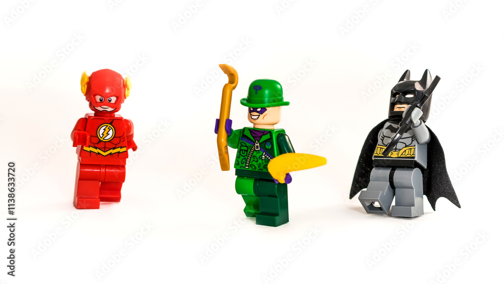 Obraz premium Lego toys Batman, Riddler and Flash from DC universe. Studio shot on white background.