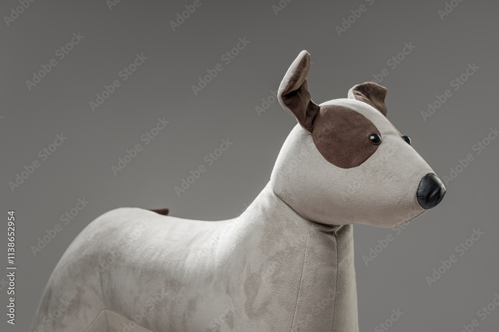 Fototapeta premium Detail of a plush stuffed dog wiht brown patch around eye