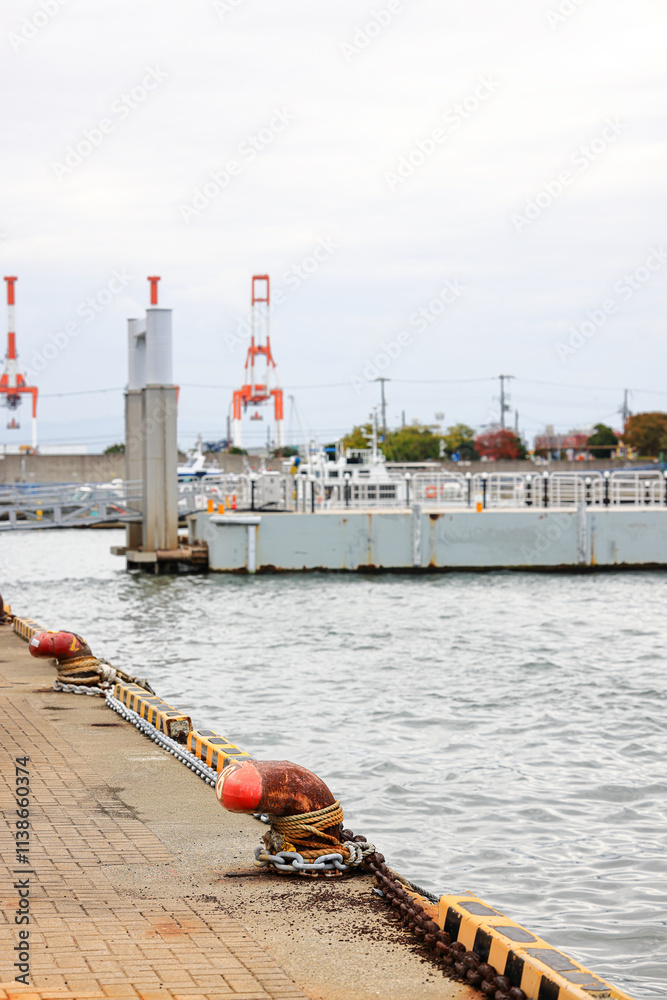 Fototapeta premium Mooring rusty bollard on pier referred to a post on a ship or quay