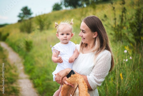 Mother hugging her little daughter.Selective focus.