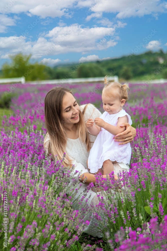 Happy mother and daughter in a lavender field Happy mother and daughter in a lavender field