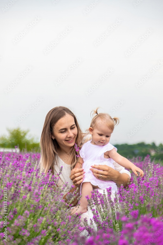 Happy mother and daughter in a lavender field Happy mother and daughter in a lavender field