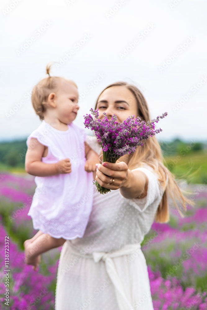 Happy mother and daughter in a lavender field Happy mother and daughter in a lavender field