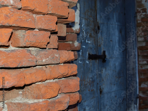 Bricks and door of an abandoned granary in Doboz