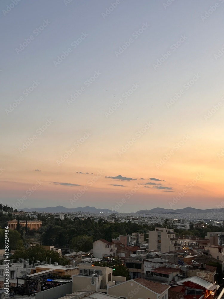 Pink Sunset Over a Greek Mountain Cityscape
