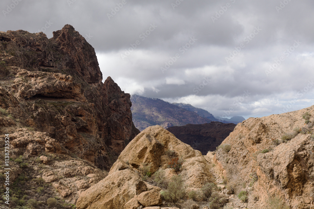 Fototapeta premium Gran Canaria, landscape of the central part of the island, Las Cumbres, ie The Summits, short hike between rock Formation Chimirique and iconic Roque Nublo
