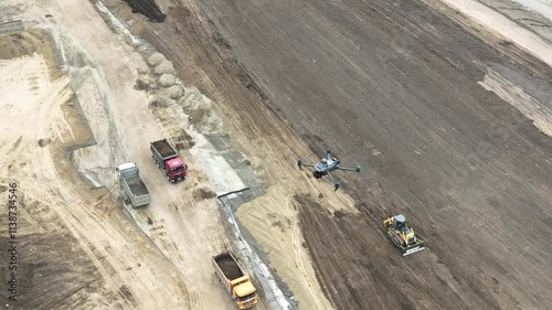 Aerial view of a drone flying over a construction site. 