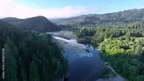 Push-in drone footage passing over the Smith River in northern California. 