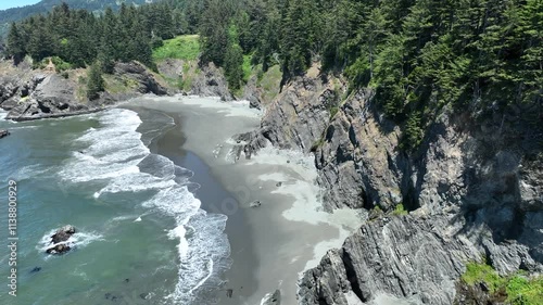 Aerial Drone footage over the secluded beach along the Oregon coastline.