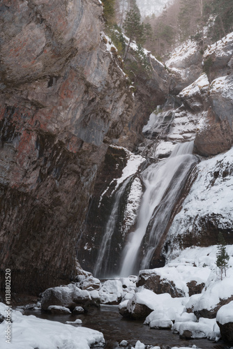 Close-up of Frozen Waterfall in Ordesa National Park, Pyrenees, Winter Nature Scene photo