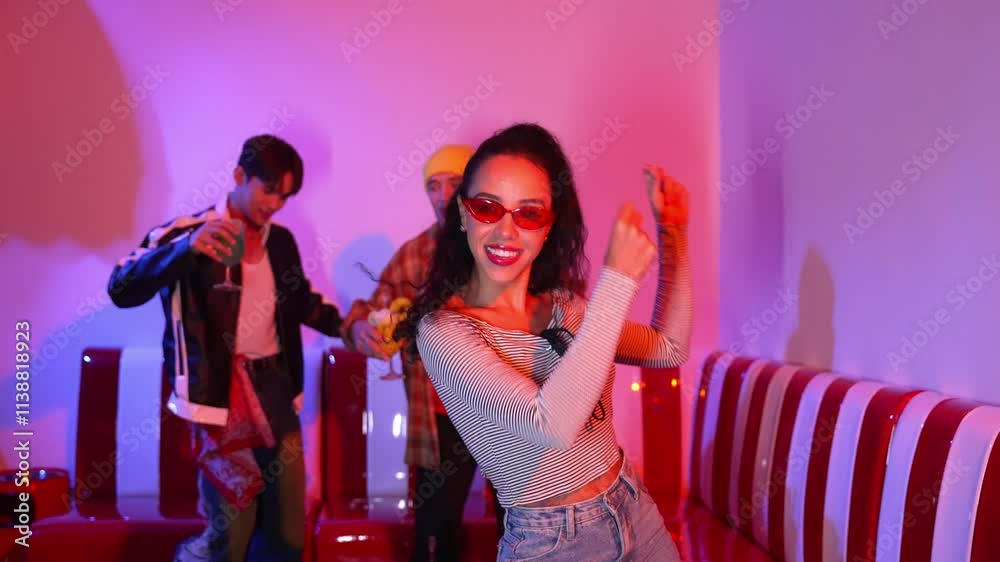 Energetic hispanic girl dancing and moving to music with multicultural friend. Diverse people perform freestyle and funny footstep while cheering and supporting female dancer performance. Regalement. Energetic hispanic girl dancing and moving to music with multicultural friend. Diverse people perform freestyle and funny footstep while cheering and supporting female dancer performance. Regalement.