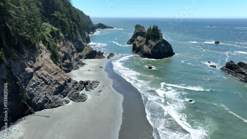 Push-in footage along the beach and islands on the Oregon coastline.