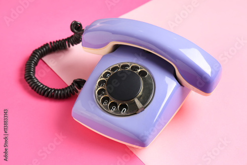 Lilac retro telephone on pi...