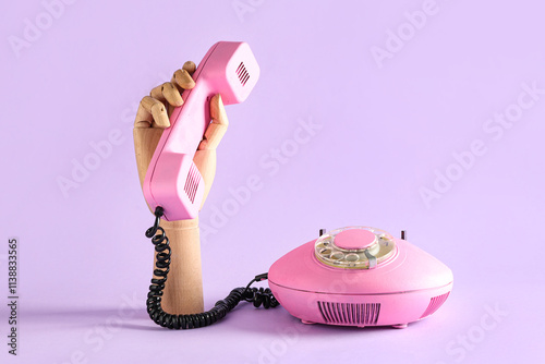 Wooden hand with pink retro...