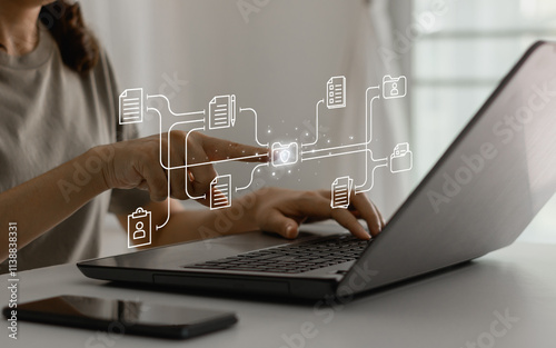 Document Management System concept, DMS. Online file sharing and transfer, cloud computing technology, data storage. Businesswoman using laptop and touching folder icon to manage electronic documents.