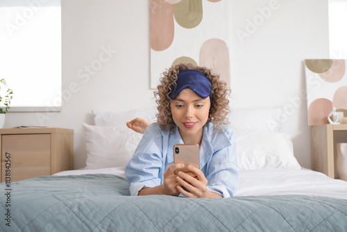 Young woman using mobile ph...