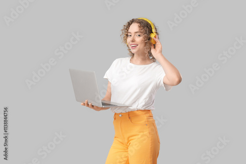 Young woman in headphones w...