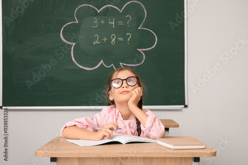 Thoughtful little schoolgir...