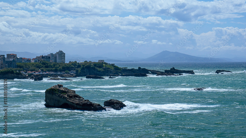 Coastal view of Biarritz on a sunny day with a beach and blue sea Coastal view of Biarritz on a sunny day with a beach and blue sea