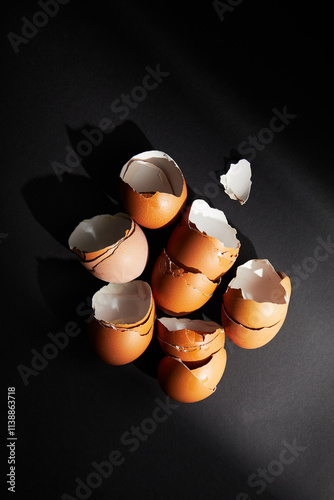 Cracked egg, eggshells isolated on black background