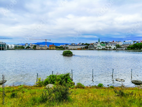 Tjörnin (the pond), a small lake in central Reykjavík, the capital of Iceland photo