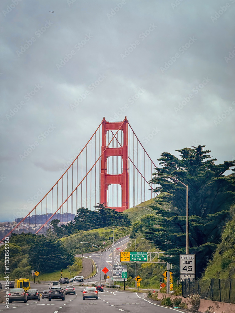 Scenic view of Golden Gate Bridge, San Francisco, California, USA from the street against cloudy sky