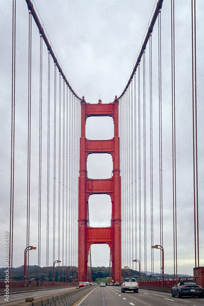 Driving along Golden Gate Bride, San Francisco, California, USA against cloudy sky from north to south