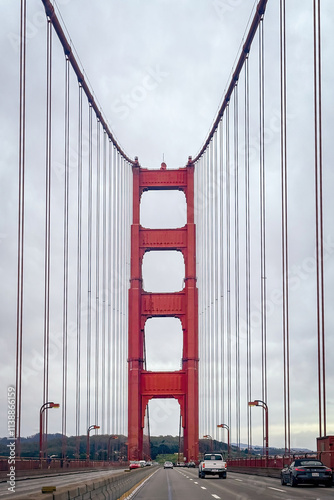 Obraz na płótnie Driving along Golden Gate Bride, San Francisco, California, USA against cloudy sky from north to south w salonie