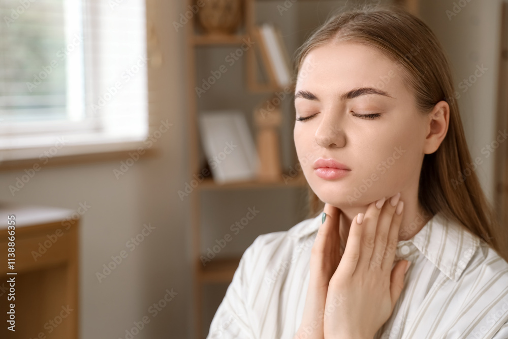 Young woman self-examining thyroid gland at home, closeup Young woman self-examining thyroid gland at home, closeup