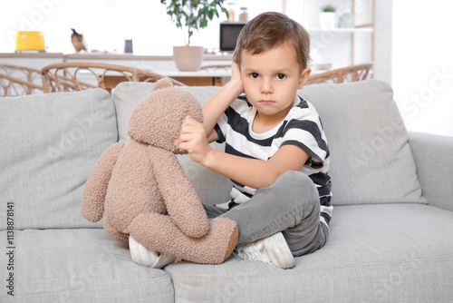Little boy with toy bear su...