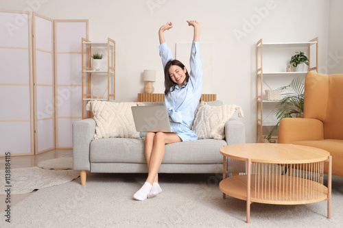 Happy young woman stretchin...