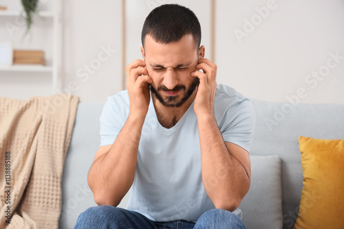 Young man with hearing prob...