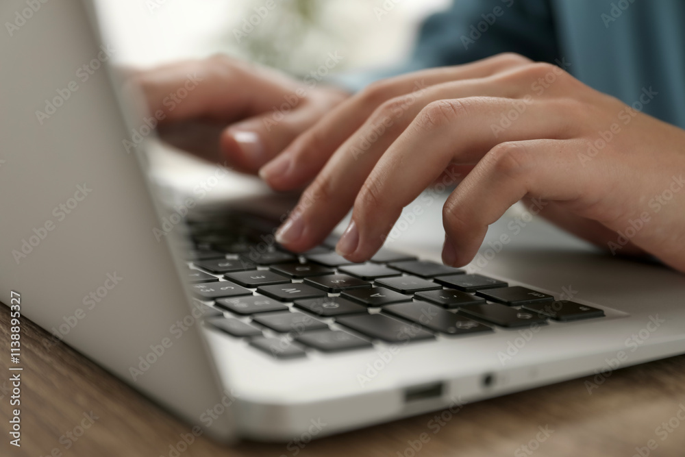 Businesswoman using laptop at wooden table indoors, closeup. Modern technology Businesswoman using laptop at wooden table indoors, closeup. Modern technology