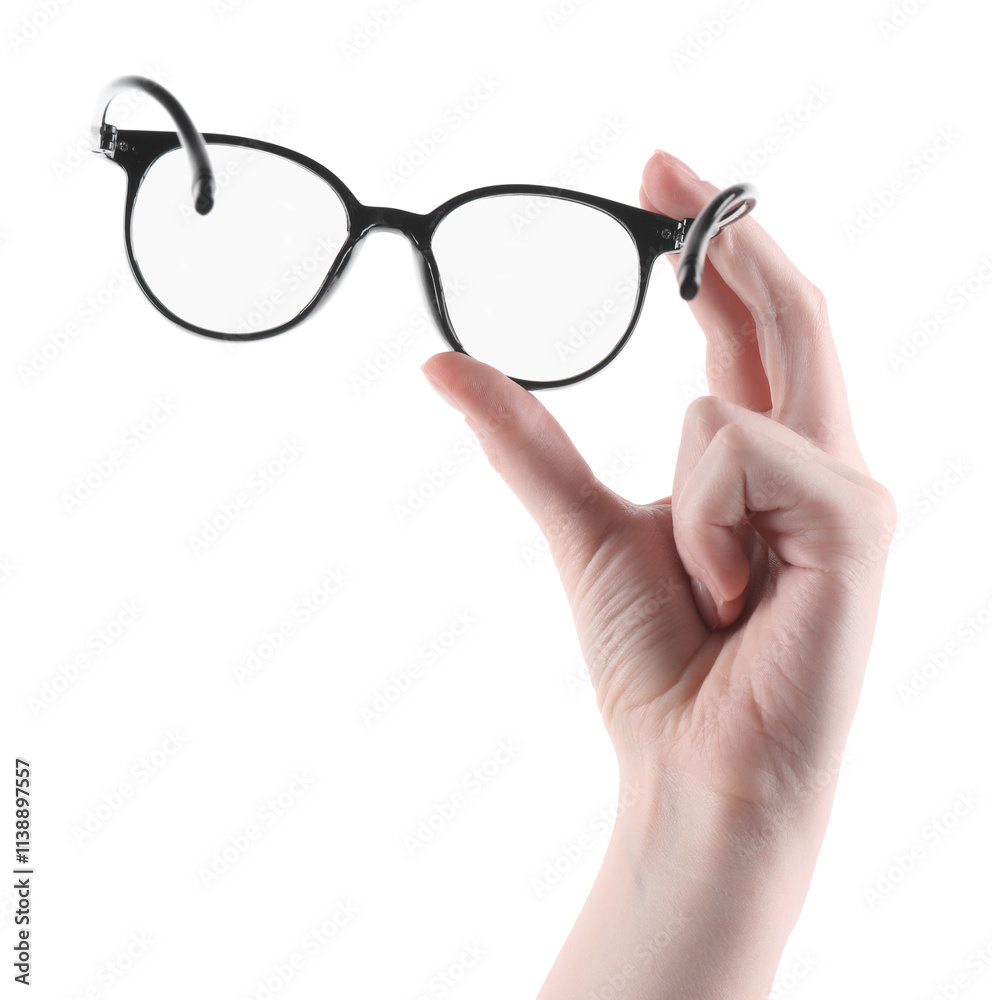 Woman holding glasses with trendy black frame on white background, closeup Woman holding glasses with trendy black frame on white background, closeup