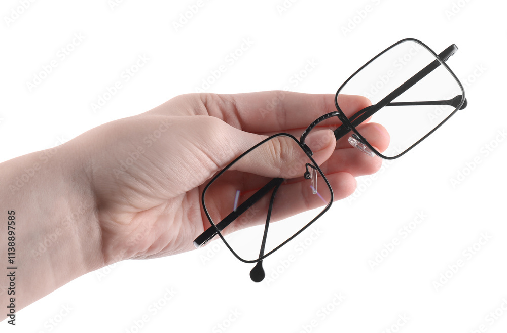 Woman holding glasses with black metal frame on white background, closeup Woman holding glasses with black metal frame on white background, closeup