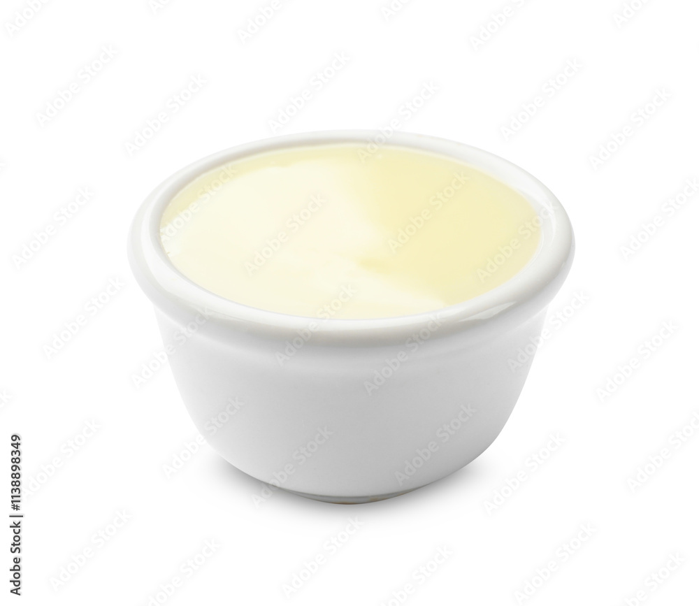 Condensed milk in bowl isolated on white