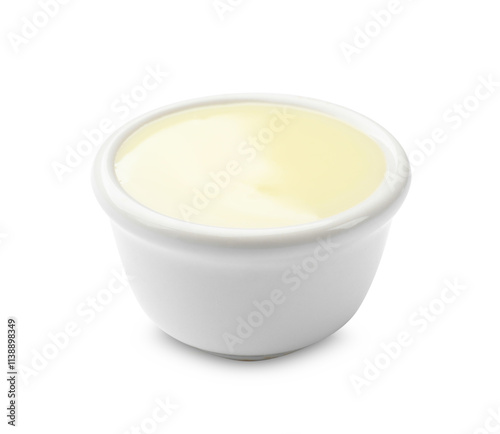 Condensed milk in bowl isolated on white